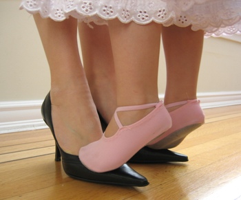 This photo of a mother and daughter "dancing" shows from where the first dance lessons come and where the love of dance is born and fostered.  One of our favorites.  Taken by Canadian photographer "Adrian".